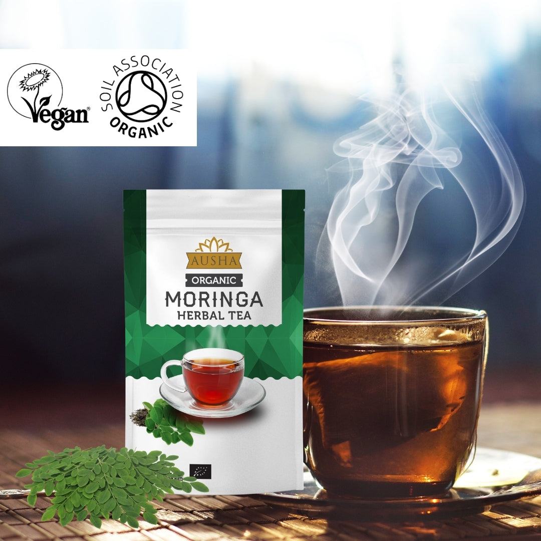 Organic Moringa Tea 100g package with steaming tea cup, vegan and organic certification logos.