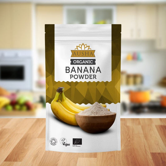 Organic Banana Powder 250g in kitchen setting, package featuring a bowl of powder and bananas.