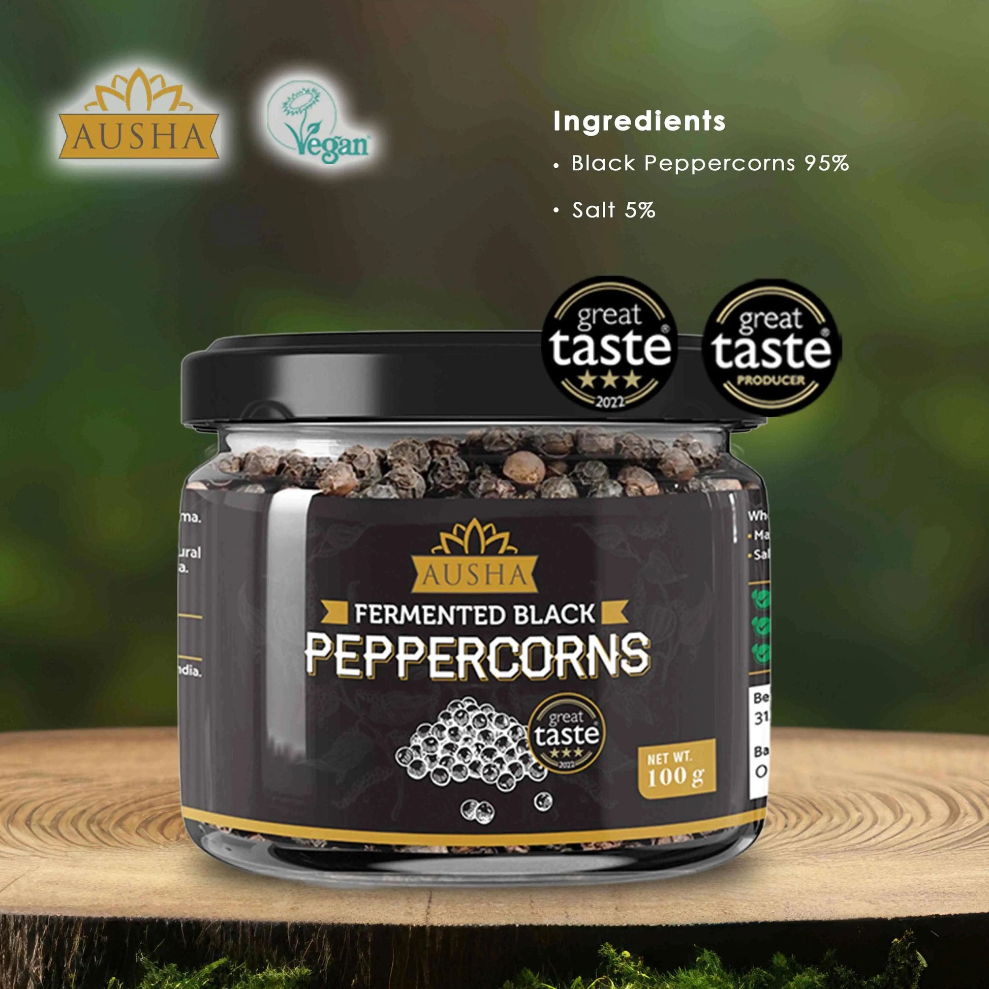 Jar of Ausha Fermented Black Peppercorns, 100g, awarded 3-star Great Taste, showcasing premium quality ingredients in a natural setting.
