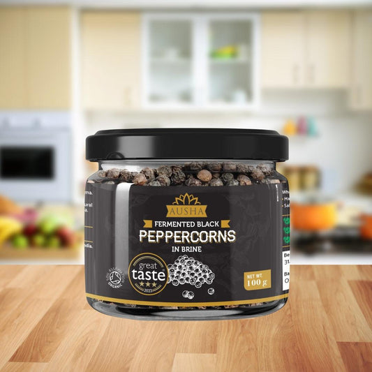Fermented Black Peppercorns 100g jar in kitchen setting, Great Taste Award 2022 winner.