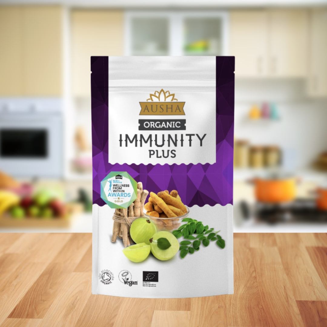 Organic Immunity Plus Superfood Powder packaging in kitchen setting.