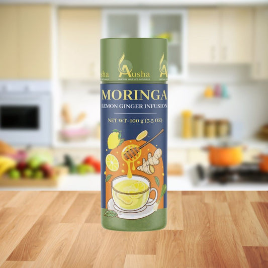 Moringa Lemon Ginger Tea packaging on kitchen counter.