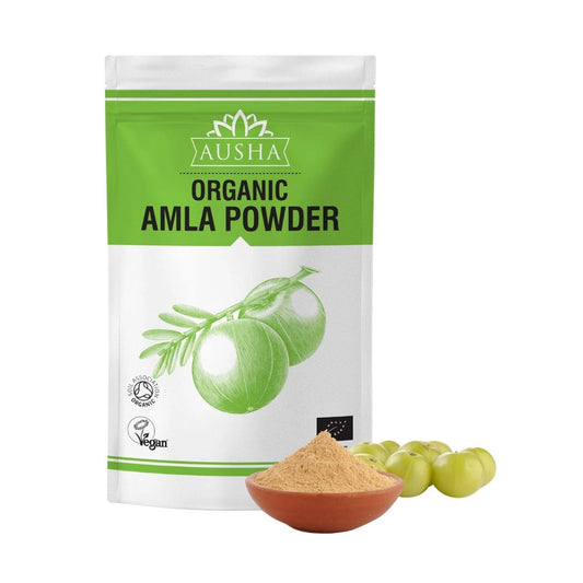 Organic Amla Powder in green packaging with a bowl of powder and fresh Indian gooseberries.