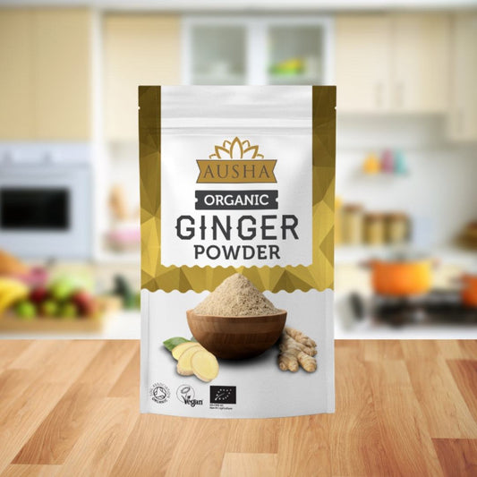 Organic ginger powder in a bag on a wooden kitchen counter.