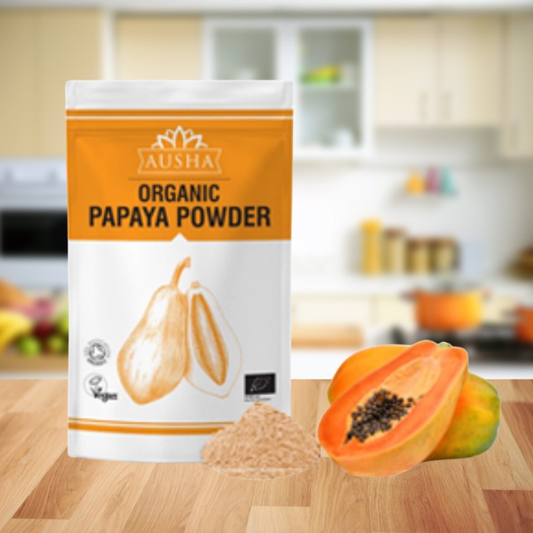 Organic Papaya Powder package on a kitchen counter with fresh papaya slices.