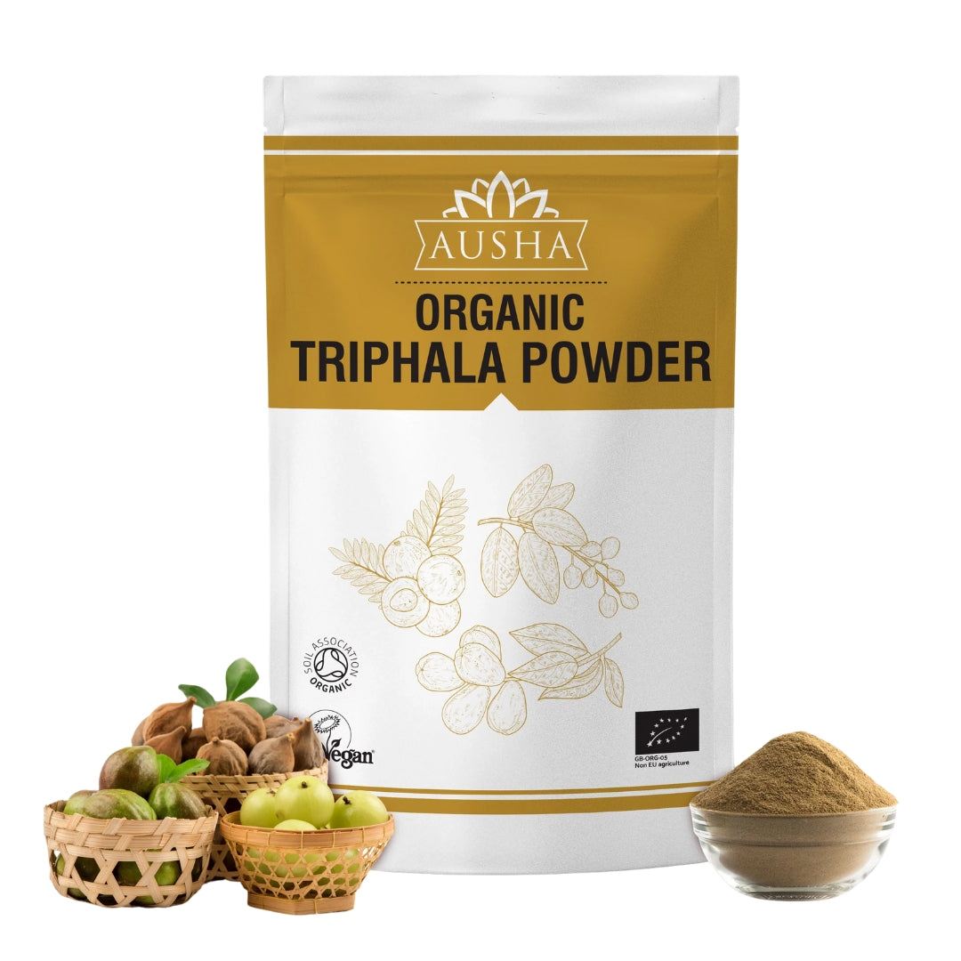 Organic Triphala Powder with Amla, Haritaki, Bibhitaki fruits and a bowl of powder.