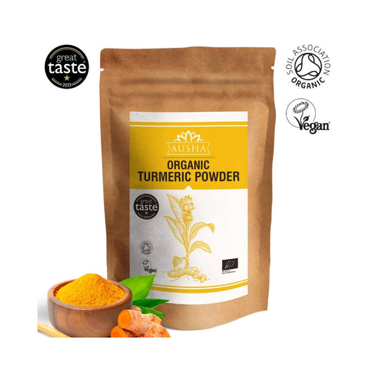 Organic turmeric powder in eco-friendly packaging with vibrant golden color, featuring vegan and organic certification logos.