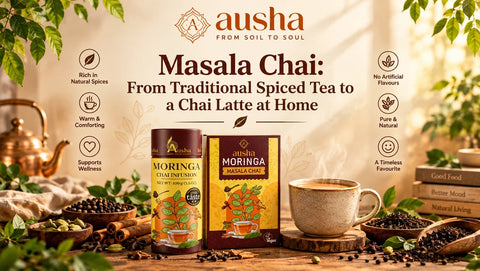 Two hands holding a steaming cup of spiced masala chai with cinnamon sticks and cardamom pods on a wooden surface