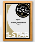 Award certificate for Organic Black Pepper, Great Taste Award 2023, 1-star rating, wooden frame.
