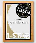 Award certificate for Organic Turmeric Powder by Ausha, showcasing Great Taste 2023 recognition.