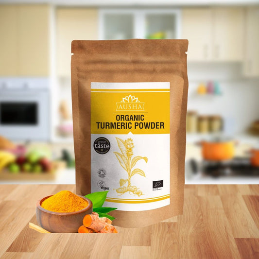 Organic Turmeric Powder in a brown pouch with vibrant golden-yellow flakes, displayed in a kitchen setting.